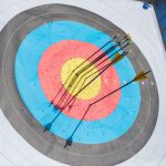 close up photo of arrows on an archery target