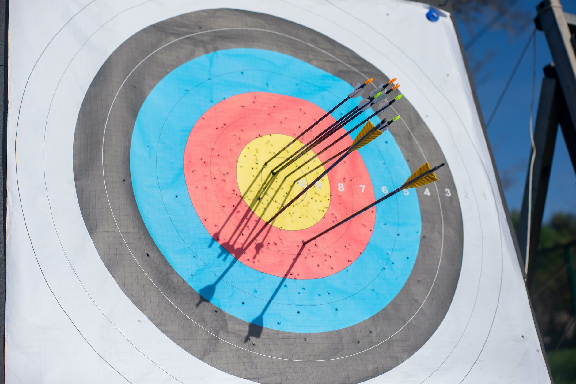 close up photo of arrows on an archery target